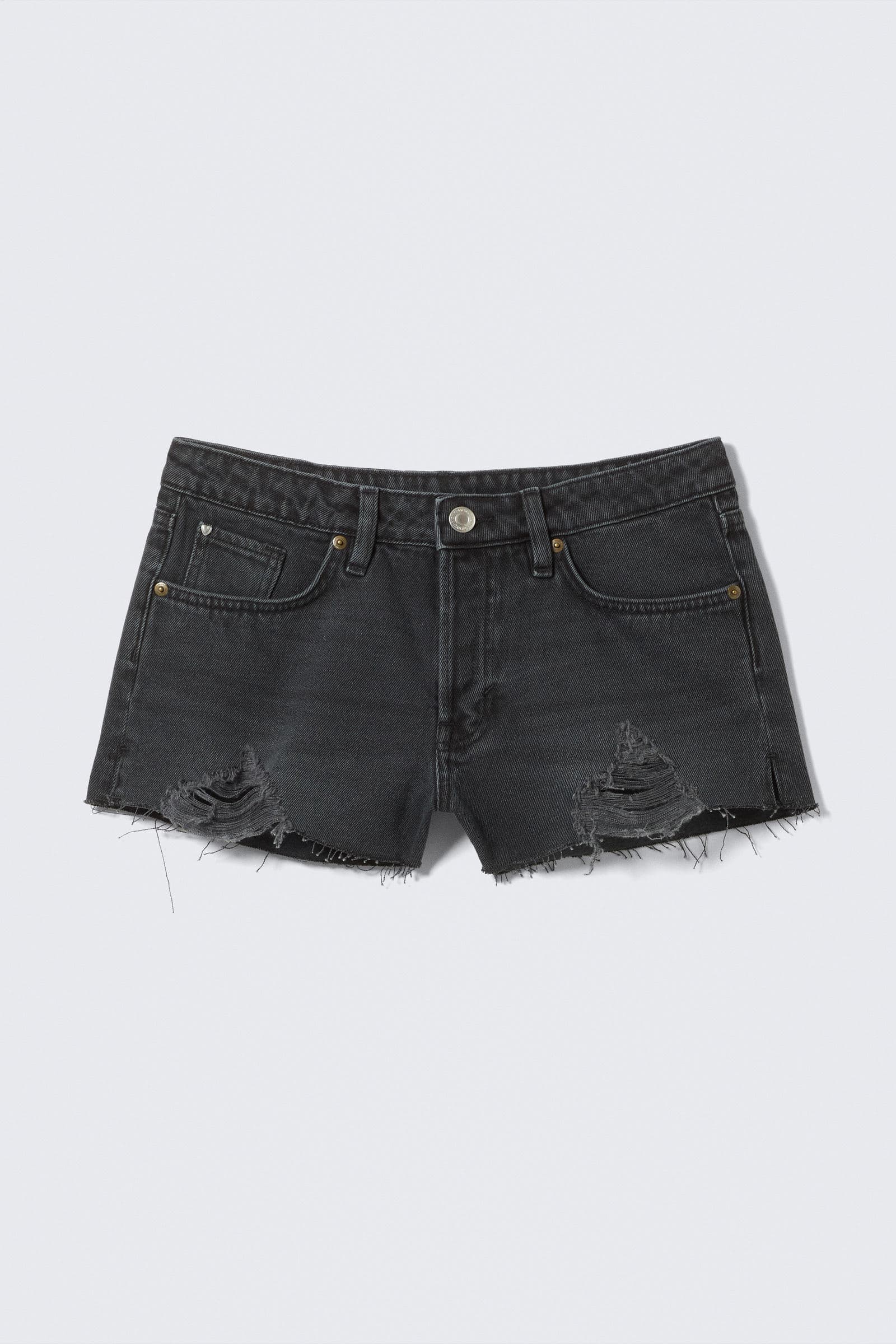 Mini denimshorts med lavt liv og rå kant